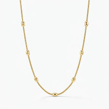 Colar bolas achatadas lisas dourado